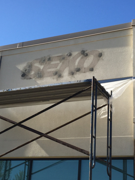 EIFS sign repair - before shot of EIFS in need of repair after sign removal